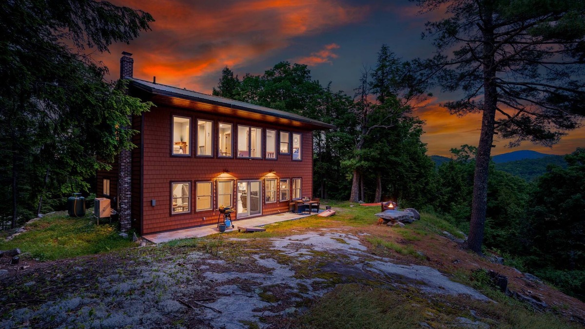 Bryant Pond Cabin | Sweeping mountain and water views from a top a mountain side