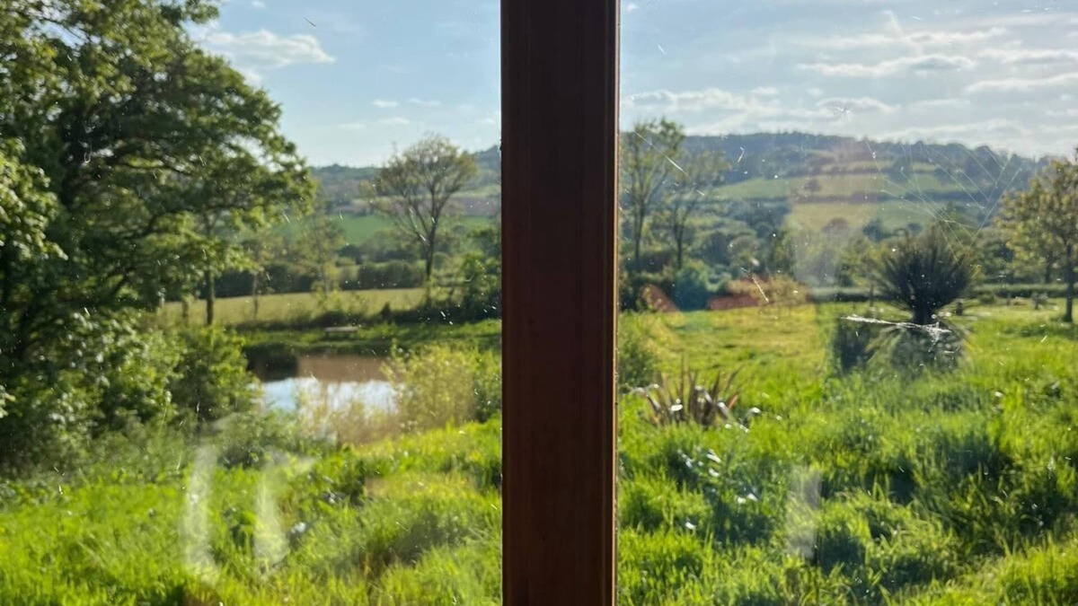 Bridport Cabin | Swimming lake coast close cosy self contained hobbit house amazing walks &views,