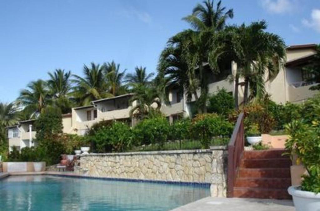 Dickenson Bay Apartment | Swimming Pool- Balcony Veranda- Sea & Sunset Views