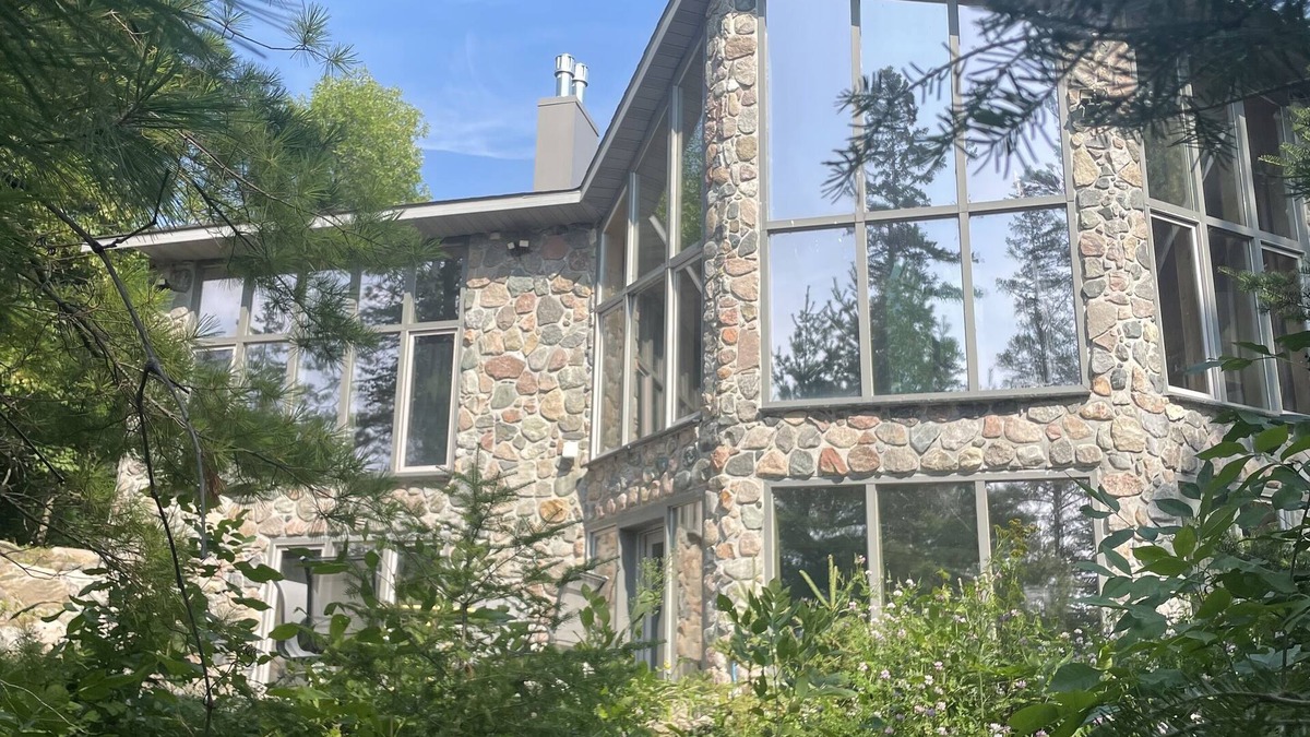 Puposky Cottage | The newly remodeled Stone Cabin with sandy beach and clean clear water