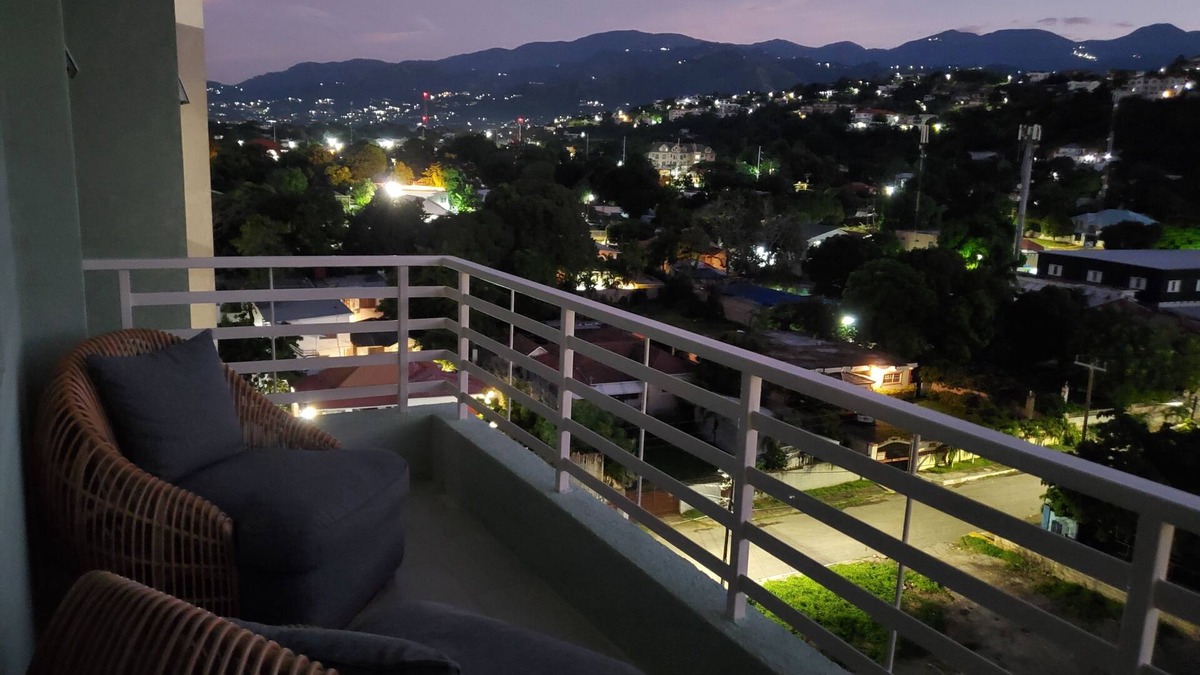 New Kingston Condo | "The Oasis" PH 1 BR with AC, WiFi, complimentary Netflix & 24/7 security.