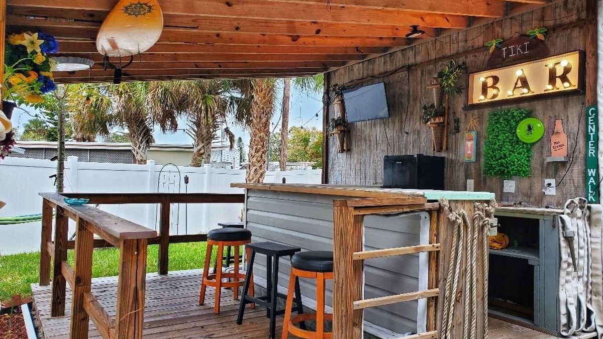 Edgewater House | The Tiki Hut Oasis, a tropical Beach home with firepit, patio, and more!