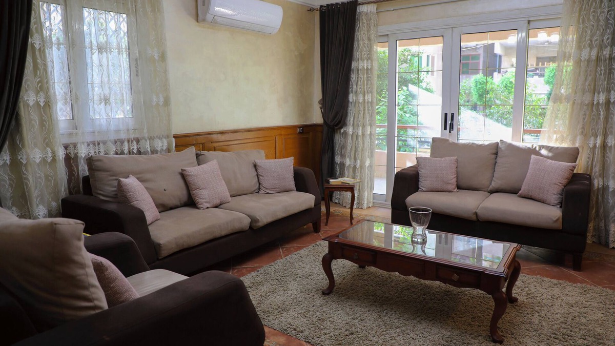 Nasr City Villa | The villa has 3 bedrooms,3 bathrooms,a dining area, and a patio with garden view