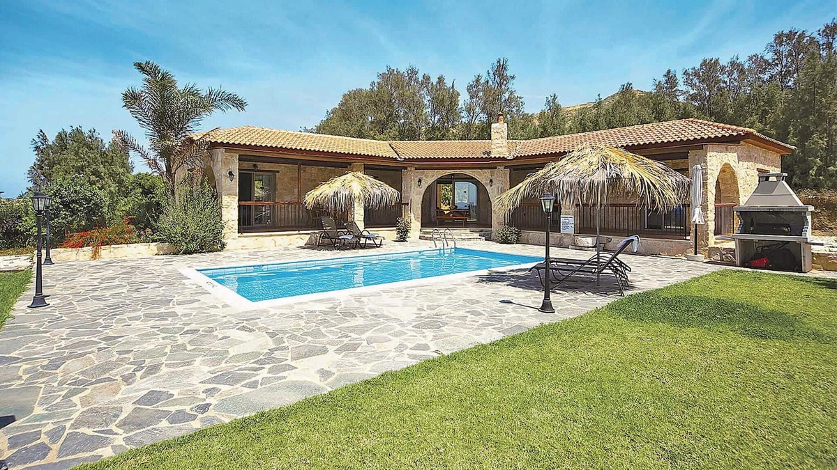 Pomos House | This attractive stone villa is set in an elevated position and commands wonderful views out across t