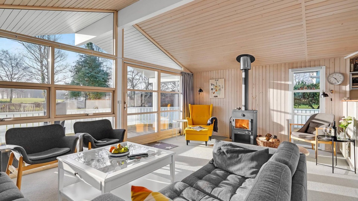 Østerskov House | This beautiful wooden house is located in a smaller cottage area, nestled in beautiful nature.