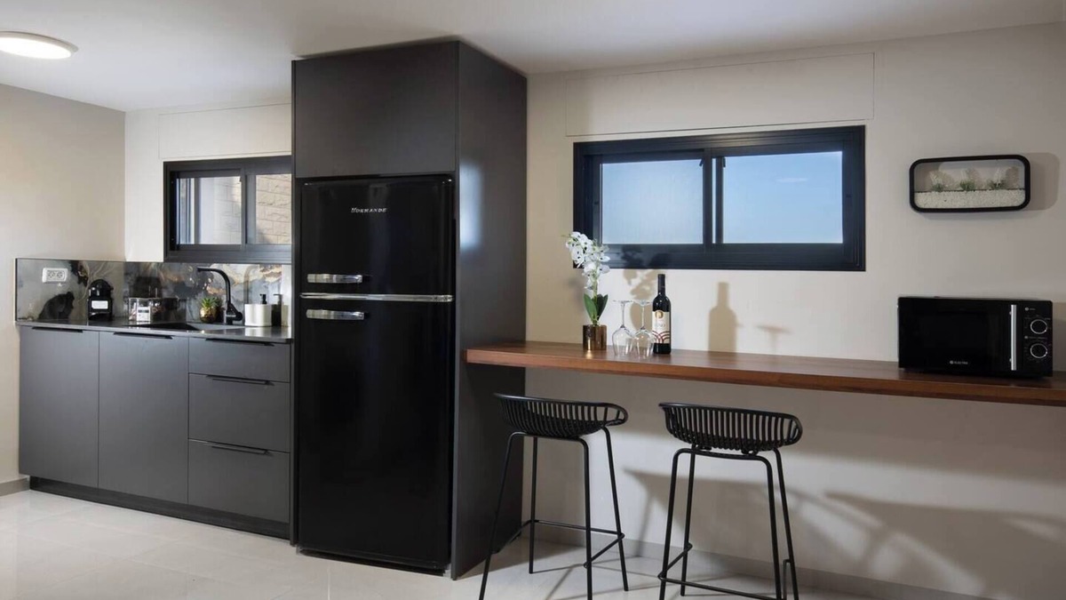 Tiberias Apartment | This cozy apartment offers ample space, featuring a comfortable living room perfect for relaxation