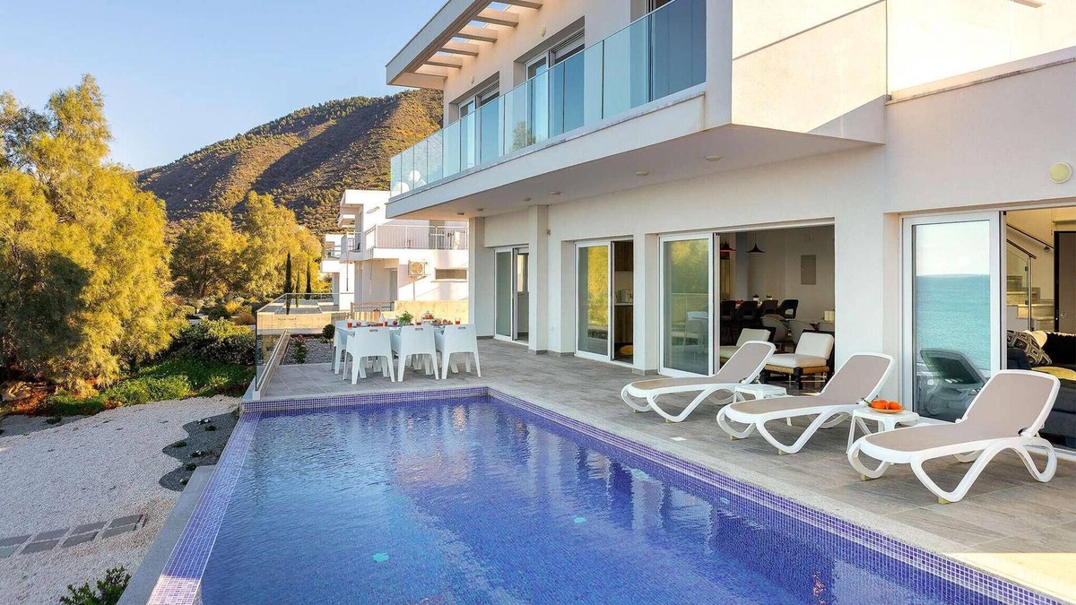 Pachyammos House | This stunning villa is modern and contemporary and has a wonderful location on the seafront in the v