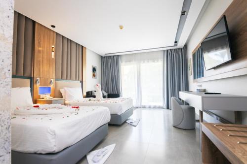 Village Road Resort | Titanic Beach - Families and Couples only