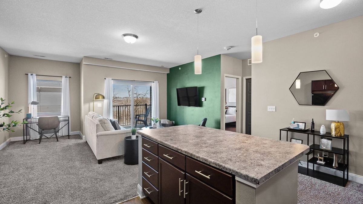West Des Moines Apartment | Top Floor! Garage Included + New Onsite Gym!