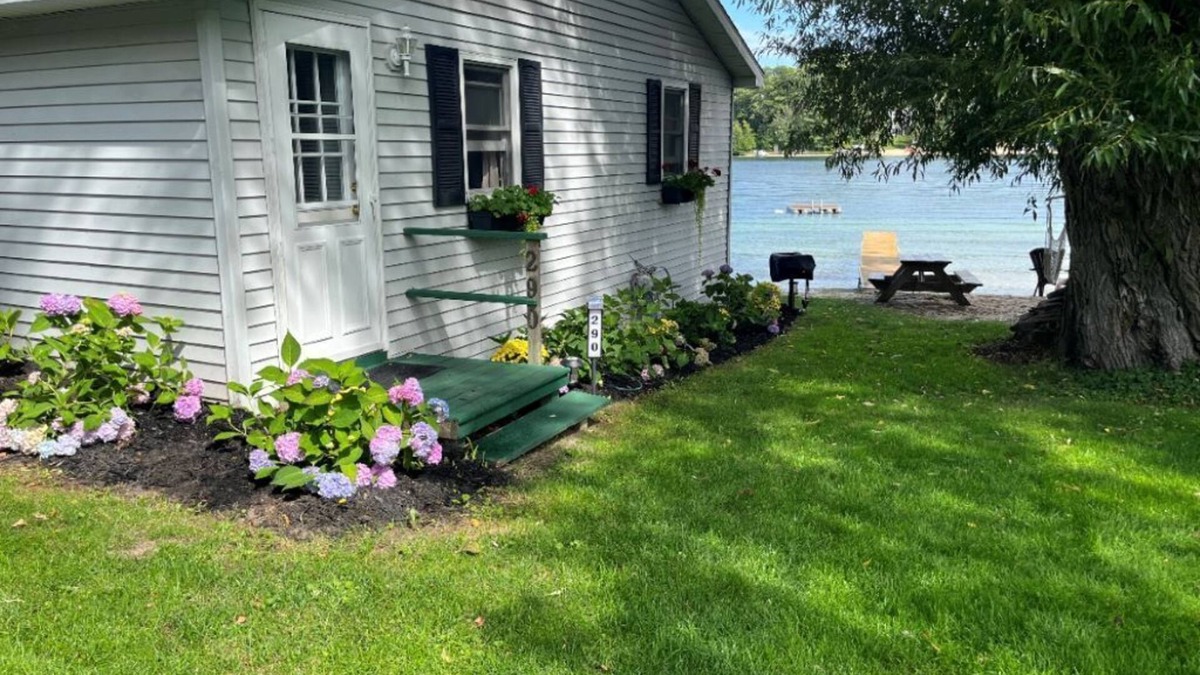 Traverse City Cottage | Traverse City's Silver Lake, DIRECT sandy beach waterfront on all sports lake.