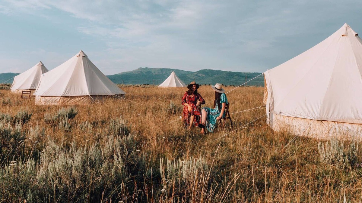 Island Park House | Triple Tent w/Shared Bathroom - Step into our open field between the mountains.