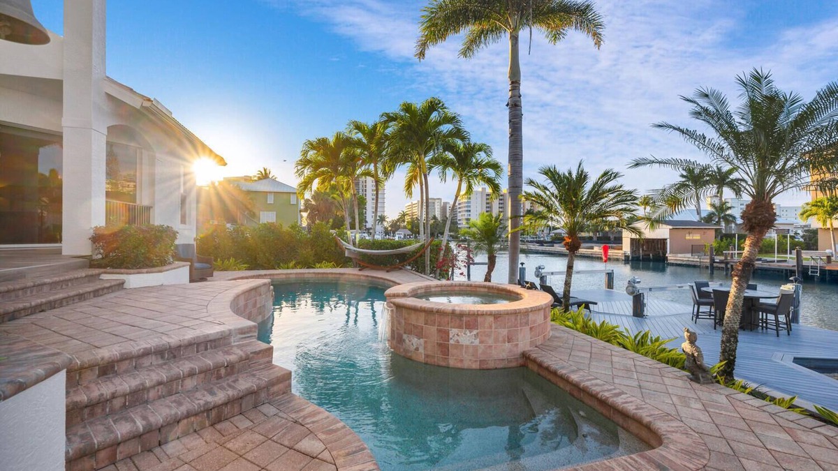 Vanderbilt Beach House | Tropical Oasis! - Luxury Canal Home! 1 Mile To The Beach! Heated Pool & Spa