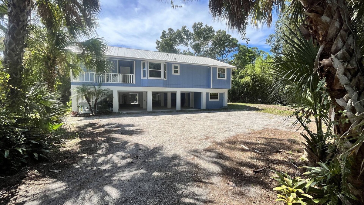 Englewood House | Tucked Away on Wooded Way located blocks from Manasota Beach with Heated Pool.