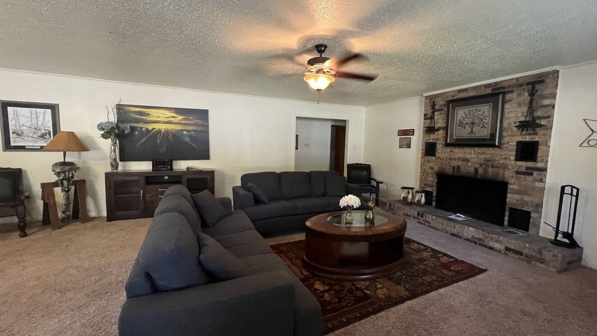 Mount Ida House | Two bedroom House with fenced in yard, covered patio area, located at the Joplin Inn at the entrance to Mountain Harbor, just 1 1/2 miles from Lake Ouachita. by RedAwning