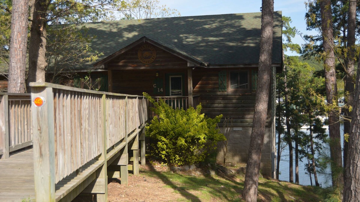 Mount Ida Cottage | Two bedroom, two bath, log-sided, luxury Harbor North cottage overlooking Lake Ouachita. by RedAwning