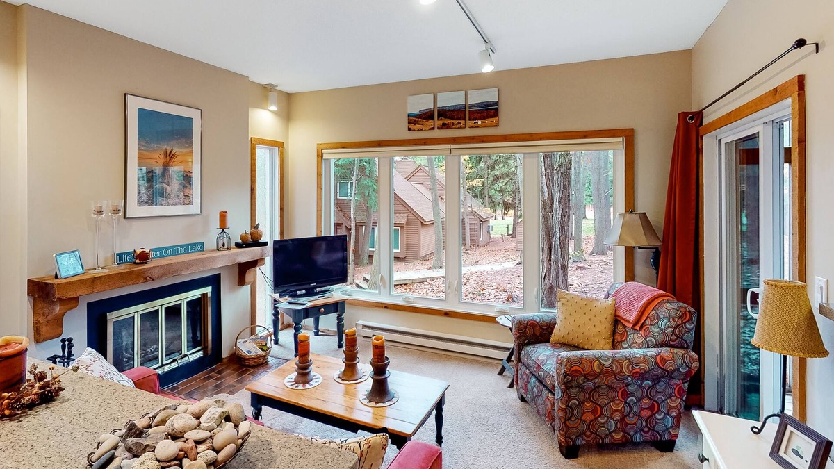 Maple City Condo | Updated, charming condo near Lake Michigan with porch, washer/dryer, fireplace