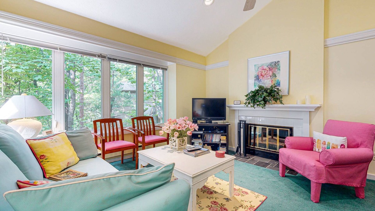 Maple City Condo | Upper-level condo with forest views, fireplace, soaking tub & high-speed WiFi
