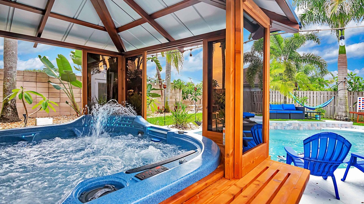 Tropic House | Urban Oasis W/hot Tub, Heated Pool And Private Movie Theater 2 Bedroom Home by RedAwning