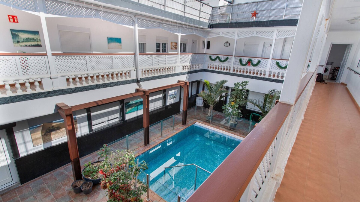 Playa de Arinaga Apartment | Vacation 'Casa Paula - 12' with Mountain View, Shared Pool and Wi-Fi
