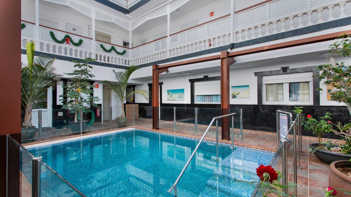 Playa de Arinaga Apartment | Vacation 'Casa Paula - 22' with Mountain View, Shared Pool and Wi-Fi