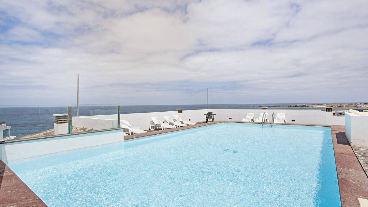 El Cotillo House | Vacation Home 'Apart 3 Dormitorios Vista Mar 4' with Sea View, Shared Pool and Wi-Fi