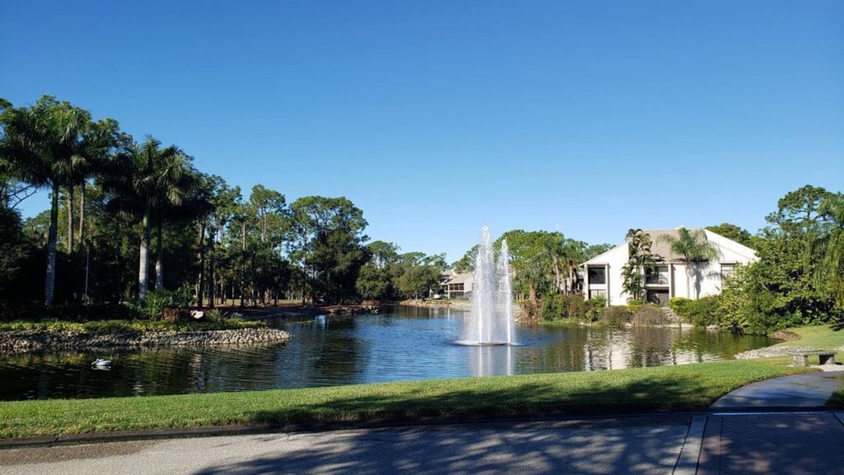 Biggar Condo | Vacation in the Forest CC heated pool view of golf course near beaches airport