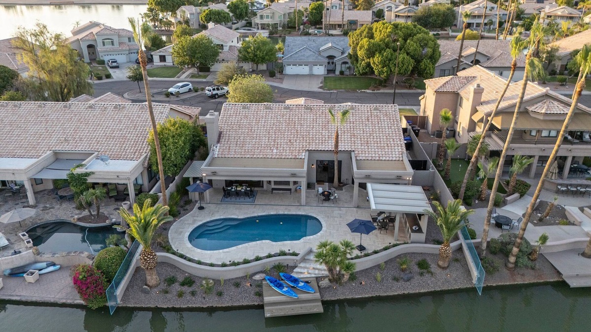 Crystal Shores House | Val Vista Lakefront Gem, Game Room, Htd Pool, Patio TV, Fire Pit, Kayaks, Bikes
