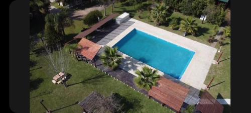 Concepcion del Uruguay House | Verde y Sol en la Colonia Bungalows y Cabañas