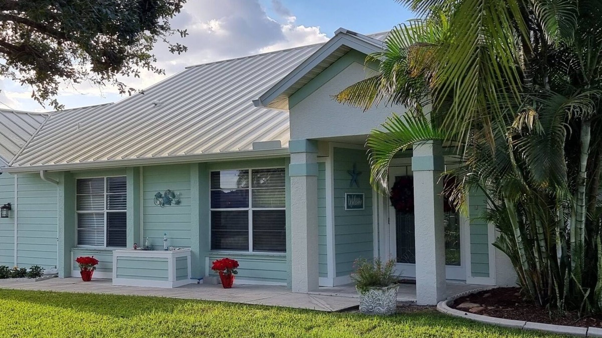 Cape Coral Villa | Villa Coral Cove heated pool, large lanai, lounge and fire pit in For Mile Cove