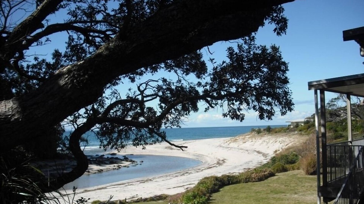 Whiritoa House | Walk straight onto the sand from the garden.