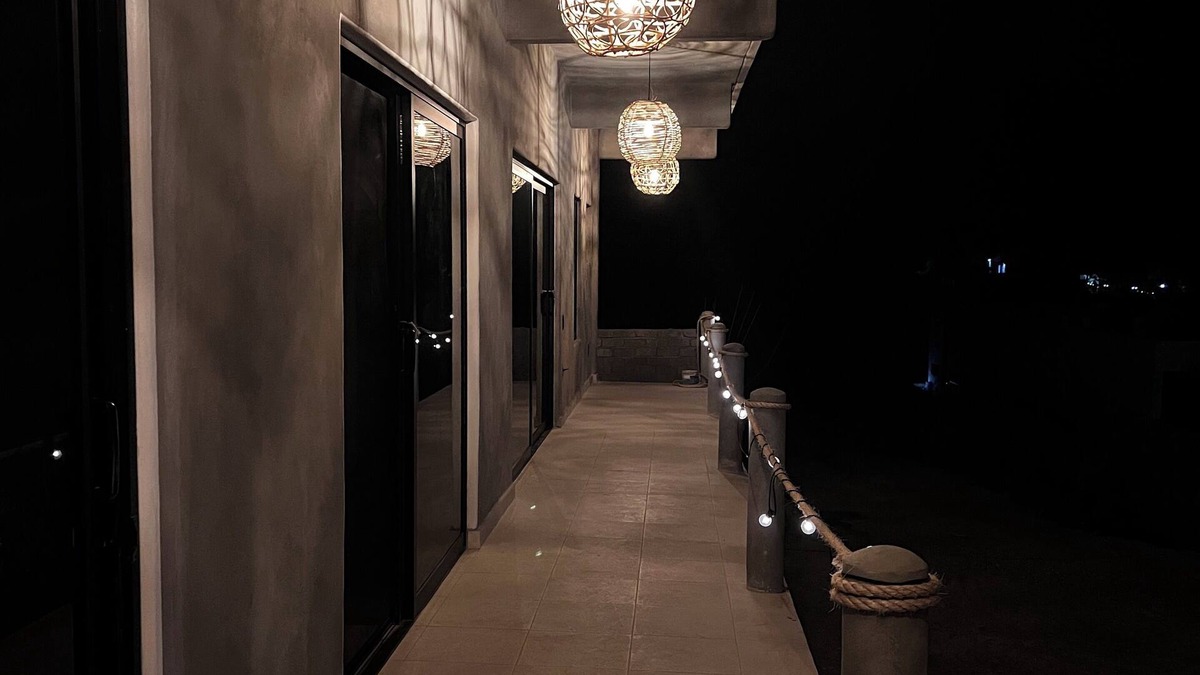 Troncones Bed & Breakfast | Warm room with the sea in the background and starry skies.