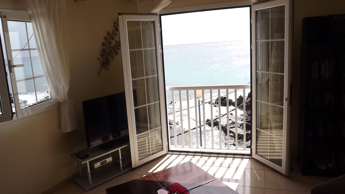 Punta Mujeres Apartment | Waterfront Apartment with roof Terrace. Children free in summer.