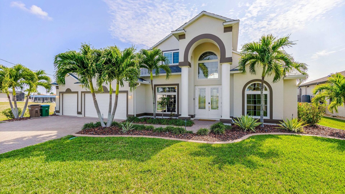 Burnt Store House | Waterfront dog-friendly house with pool, dock, pool spa, patio & sunrise views