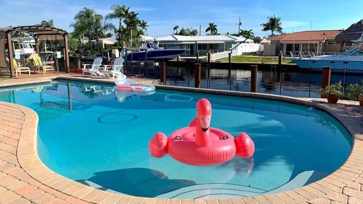 Garden Isles House | Waterfront Home, Large Heated Pool, 5 min. from the beach, family friendly