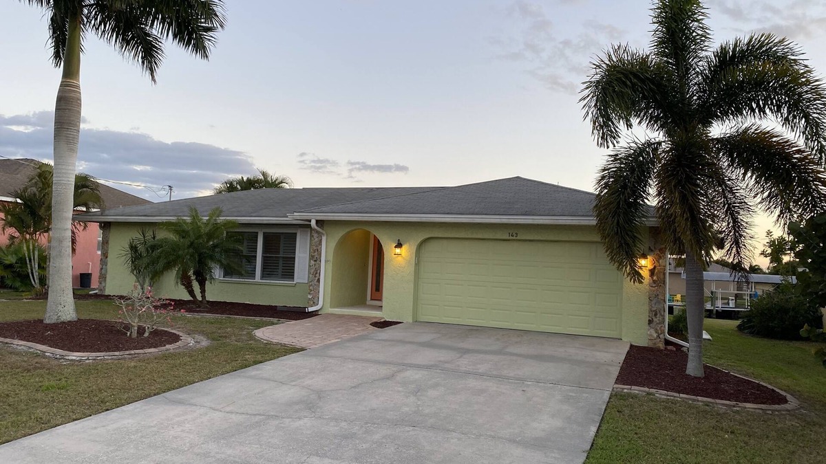 Edgewater House | Waterfront house, boat dock, pool, walking distance to Port Charlotte Beach