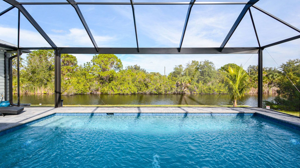 Port Charlotte House | Waterfront Key West Style Home with Heated Pool Located in South Gulf Cove