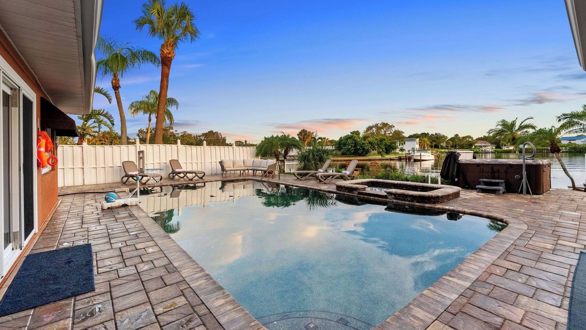 Harbor Hills House | Waterfront Oasis w/Pool, Spa, Boat & Jet ski Dock, Game Room & Outdoor Kitchen