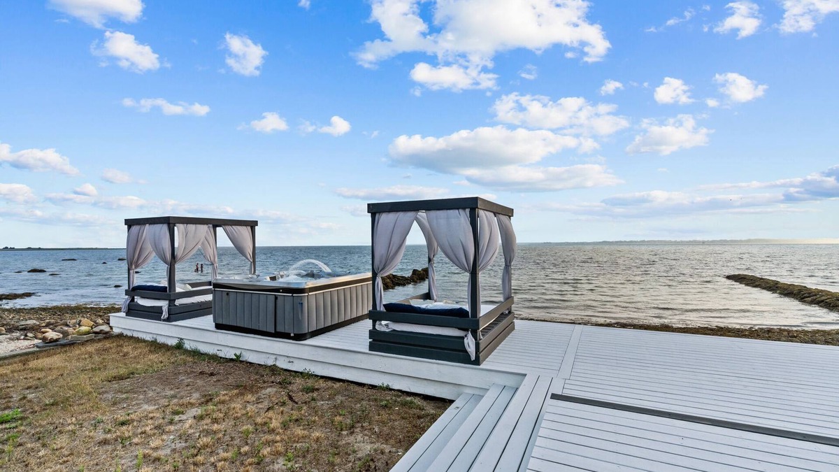 Fairhaven House | Waterfront Oasis with day beds and hot tub with captivating sunsets.