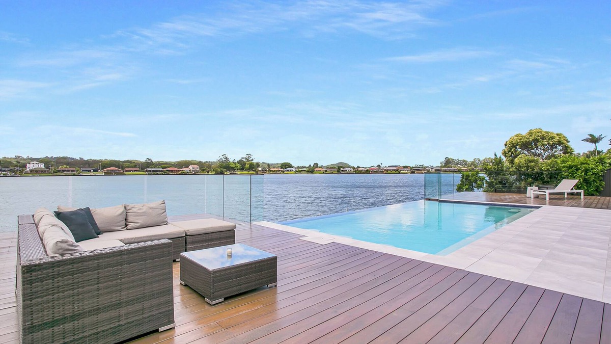 Elanora House | Waterfront Retreat with Infinity Pool & Canal Views