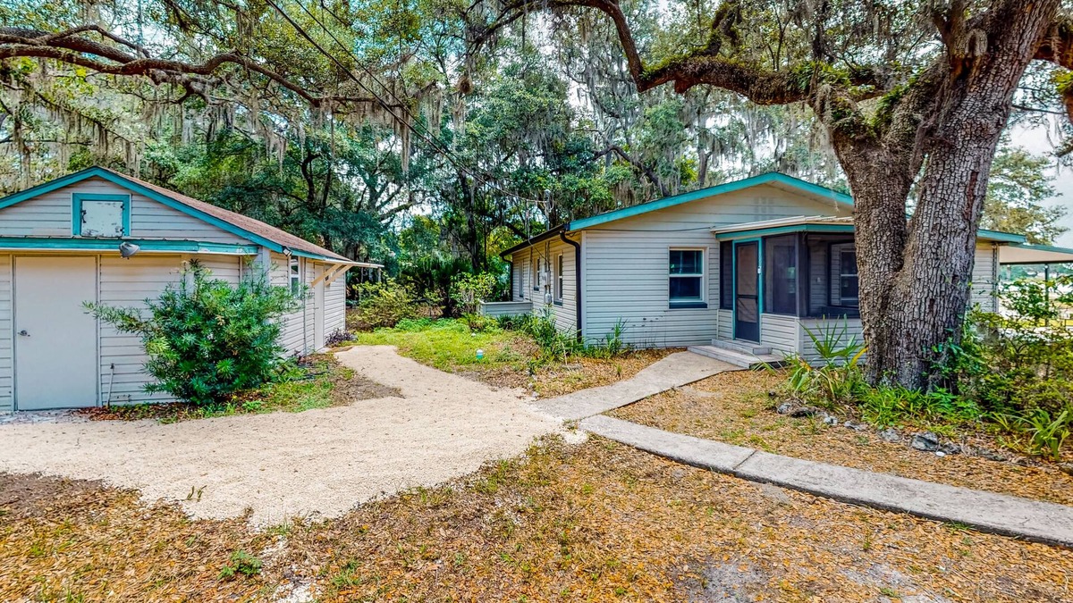 Candler House | Waterfront stay with a dock, firepit, grill, sunroom, separate studio, W/D, & AC