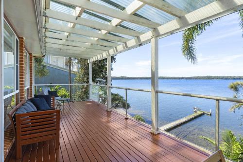 Sunshine House | Waterfront Vista Escape with Games Room Jetty Access & Expansive Views