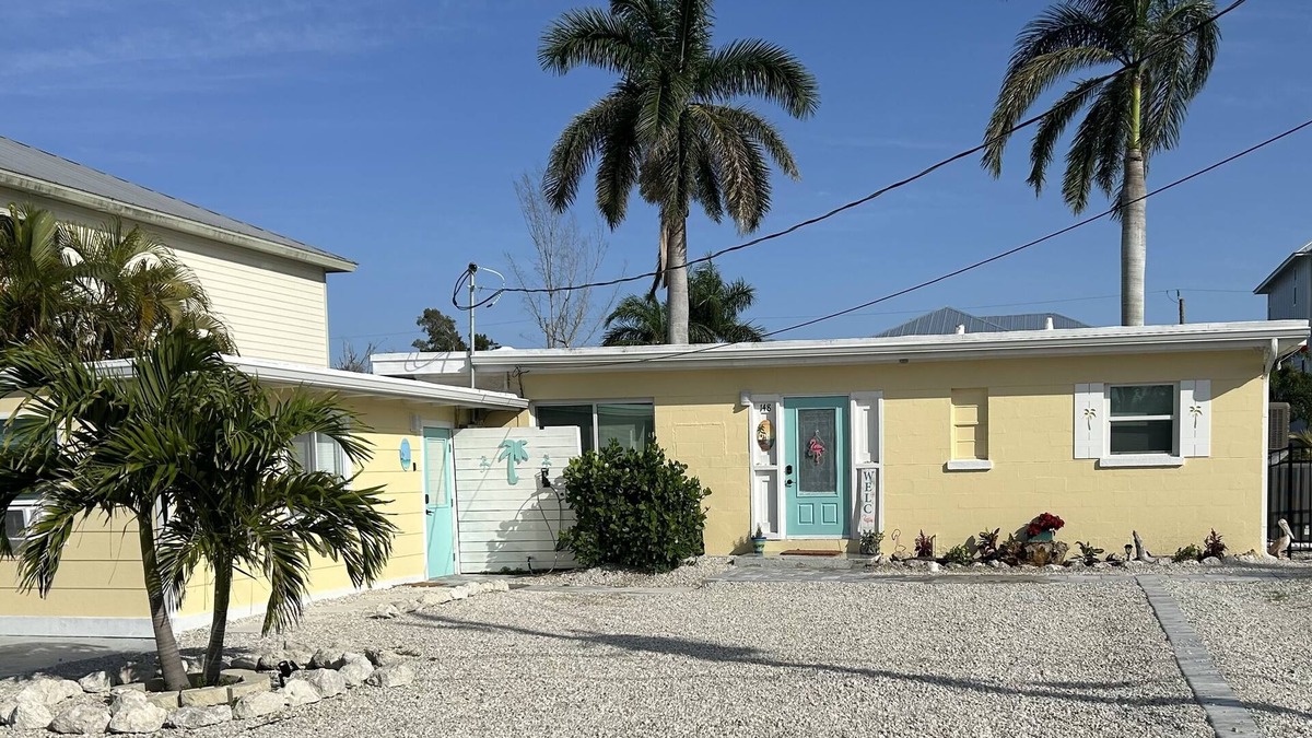 South Island House | WE ARE BACK! NEWER POOL/SPA and Walk to beach! Totally updated Canal front home!