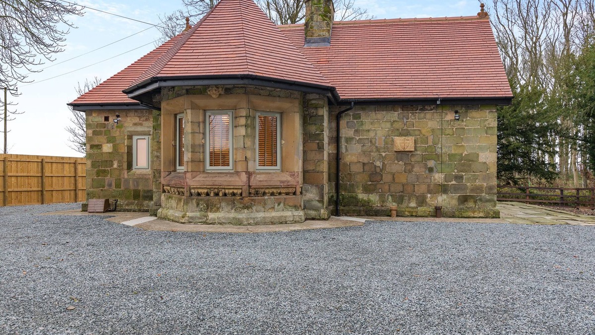 Driffield Cottage | We love this historic lodge with large garden and wood fired hot tub.