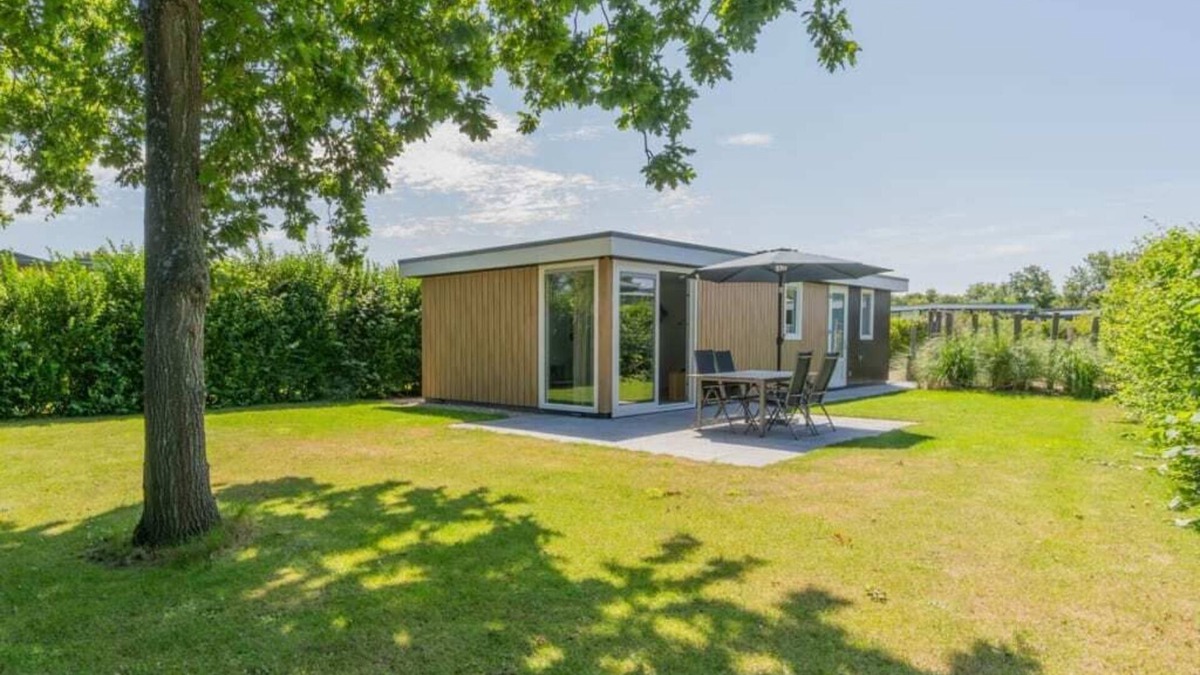 Burgh-Haamstede House | What immediately catches your eye upon entering is the garden-oriented living room with open kitchen