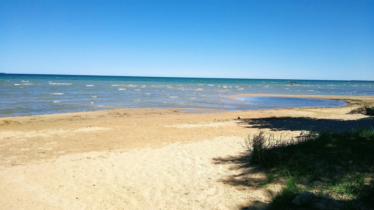 Caseville Cottage | 'Whispering Oaks' Cottage with Lake Access, Outdoor Fire Pit and More!
