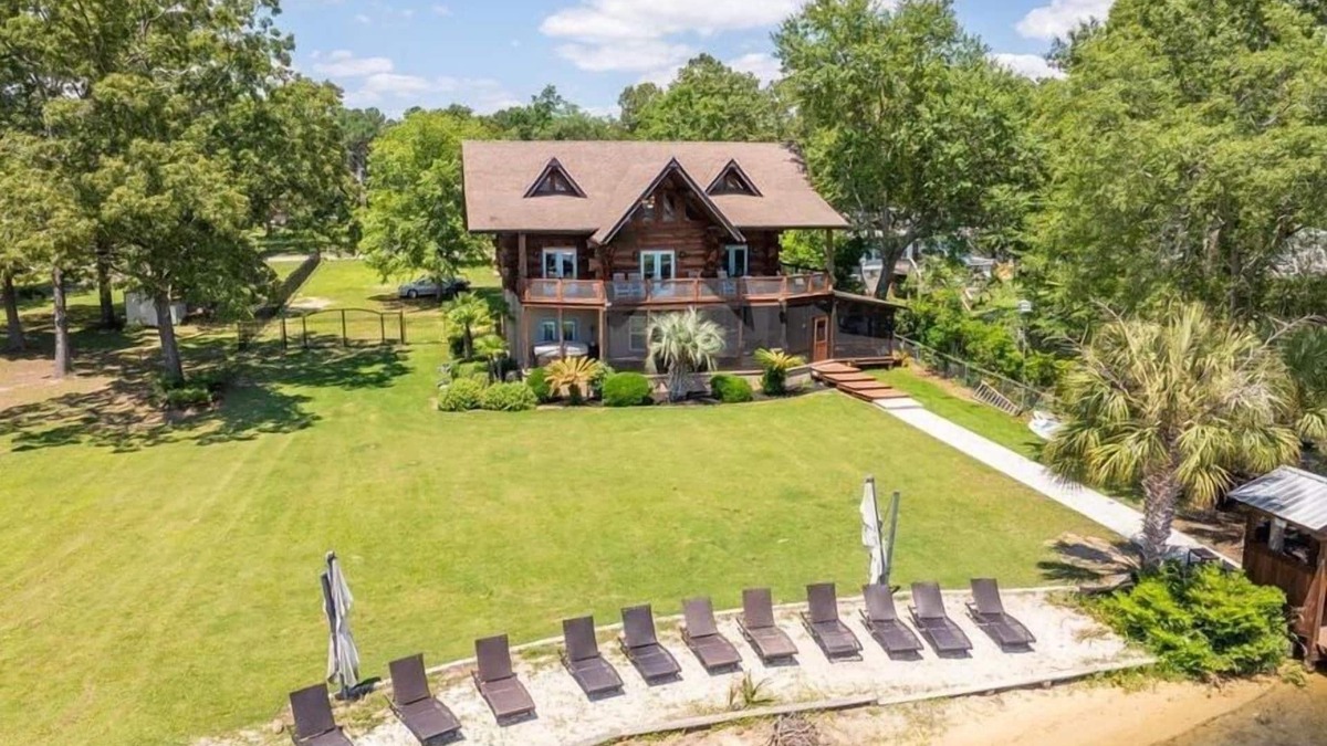 Manning House | Wyboo Lakefront Premier: Log Cabin on the Water!