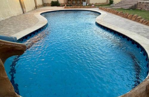 6th of October City Villa | فيلا للايجار اليومى فى الريف الاوربي طريق مصر اسكندرية الصحراوي قريبة من مطار سفنكس وبجوار هايبر وان الصحراوي- 5 غرف نوم-حمام سباحة-شواية- كيدز ايريا- جيم- بلياردو