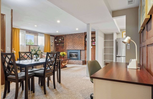 Northwest Calgary House | 2BR Cozy Suite Fireplace Yoga Studio FREE Banff Pass Parking Netflix!