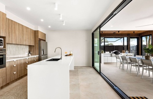 Mooloolaba House | 7 bedroom home on canal with private jetty for casual fishing and separate living areas for the exte