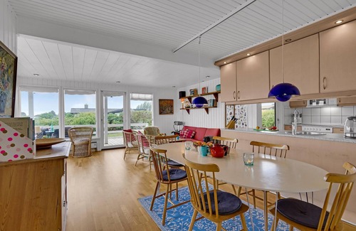 Helnæs By House | A simple cottage with terrace and bright living room.